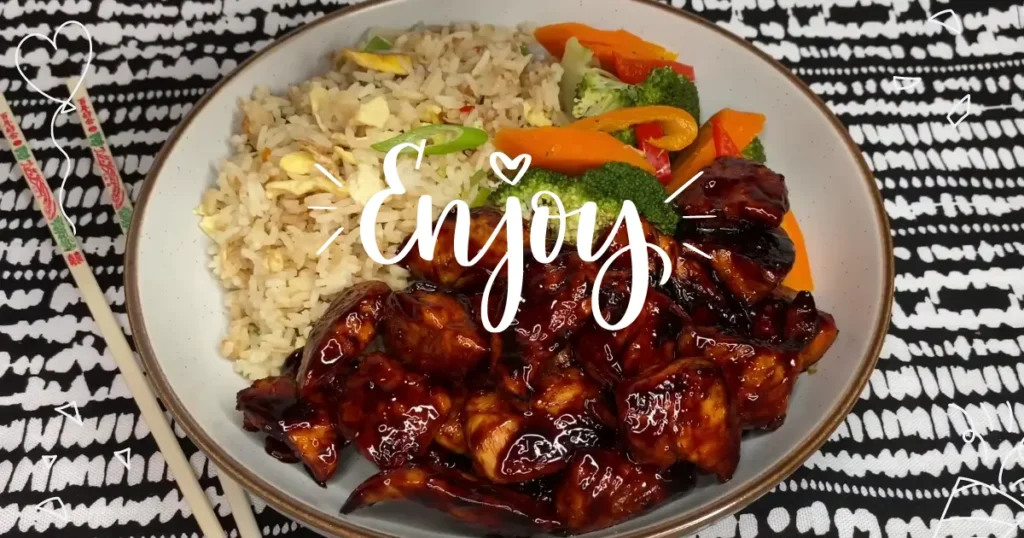 chicken teriyaki bowl is served with some stir-fried veggies and rice 