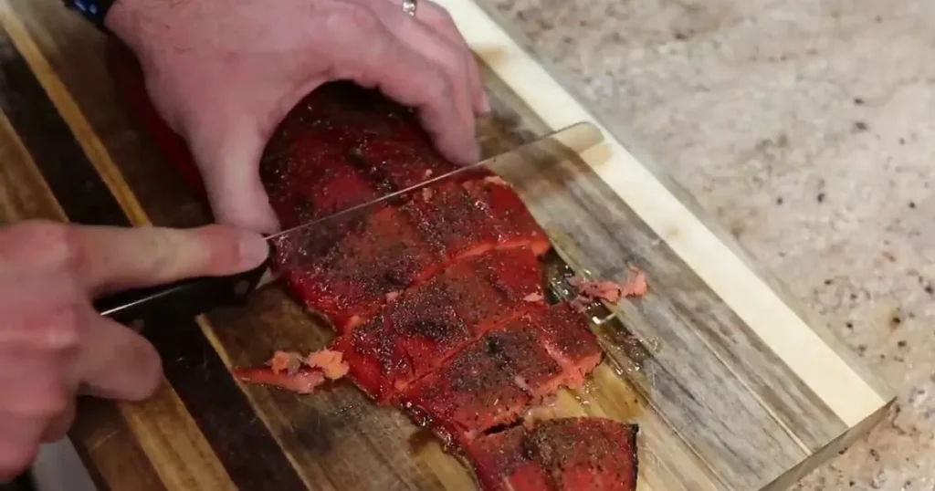 slicing the smoked fish and now it is ready to serve