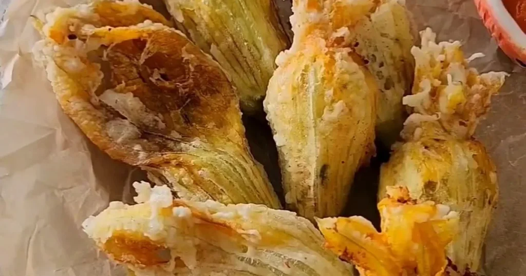 zucchini blossoms stuffed and served in a dish