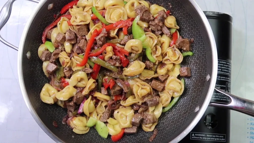 Best Cheesesteak Tortellini For Quick One-Pan Dinner making of Cheesesteak Tortellini